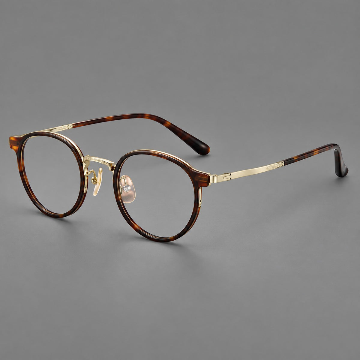 Round eyeglasses in acetate and titanium with widened outer corners and slender metal temples — Tortoiseshell / Gold — Main view [CINILY-JD2026-61028-C1]