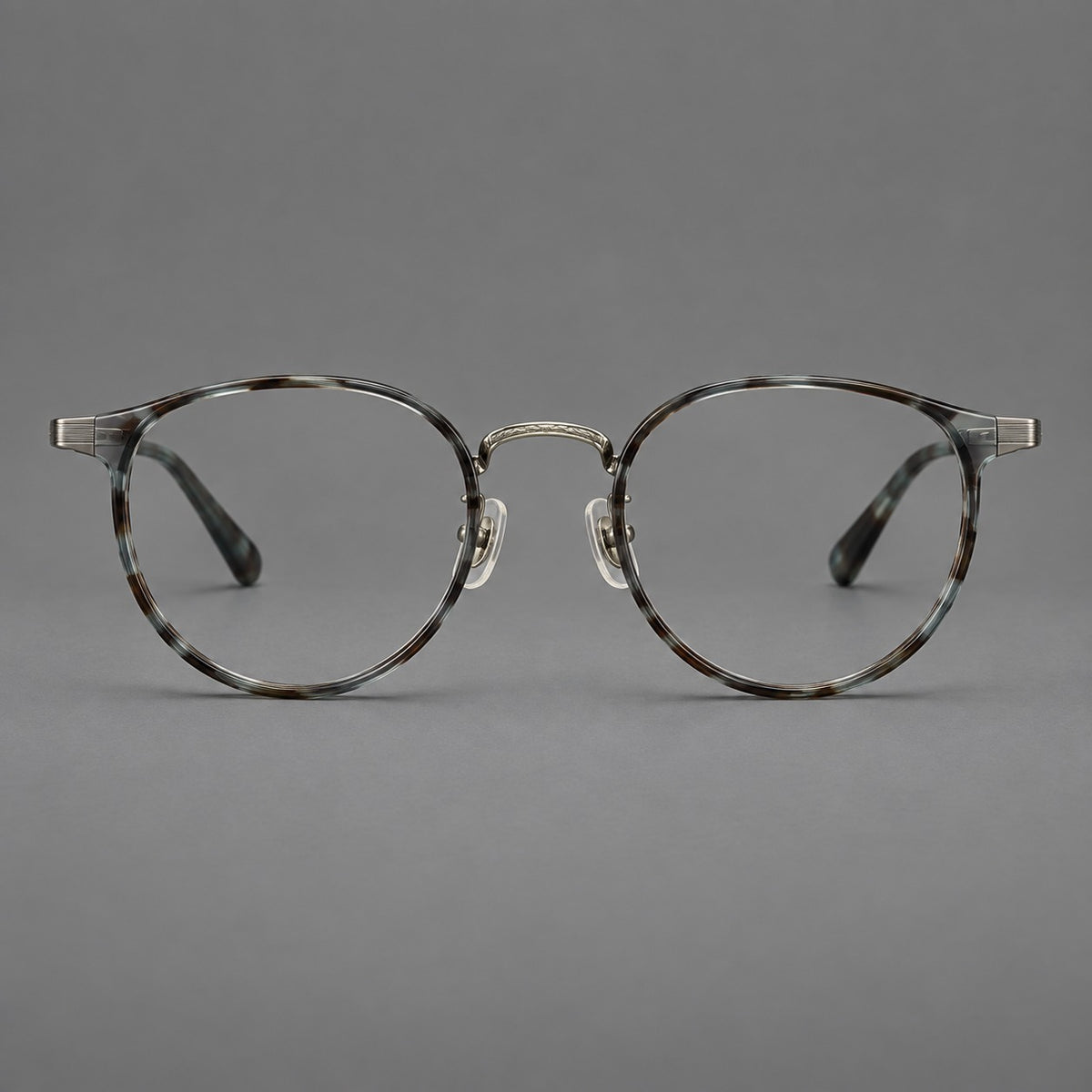Round eyeglasses in acetate and titanium with widened outer corners and slender metal temples — Green Grey Tortoiseshell / Gunmetal — Front view [CINILY-JD2026-61028-C2]