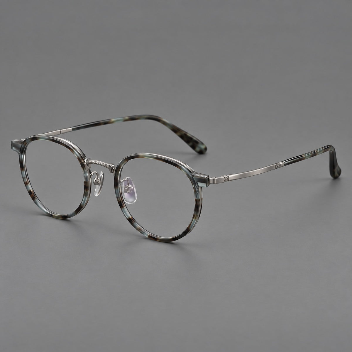Round eyeglasses in acetate and titanium with widened outer corners and slender metal temples — Green Grey Tortoiseshell / Gunmetal — Main view [CINILY-JD2026-61028-C2]
