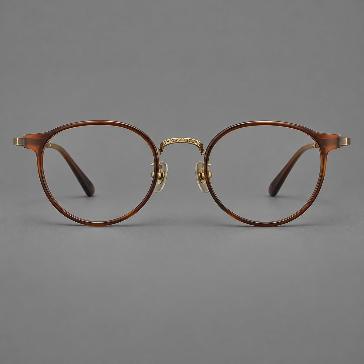 Round eyeglasses in acetate and titanium with widened outer corners and slender metal temples — Coffee Brown / Antique Bronze — Front view [CINILY-JD2026-61028-C5]