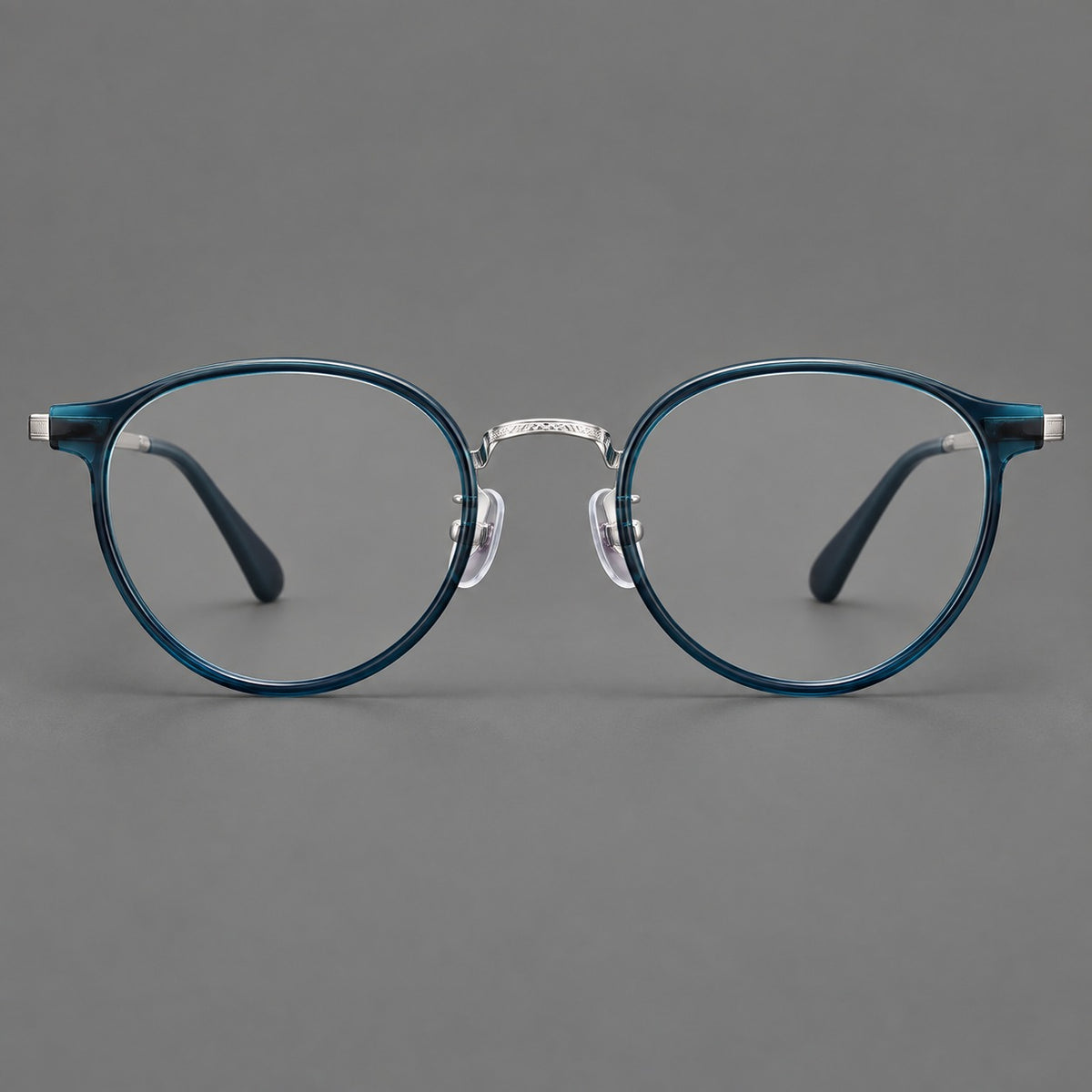 Round eyeglasses in acetate and titanium with widened outer corners and slender metal temples — Peacock Blue / Silver — Front view [CINILY-JD2026-61028-C6]