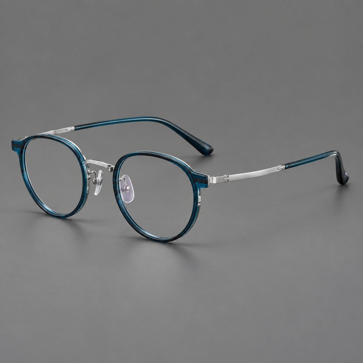 Round eyeglasses in acetate and titanium with widened outer corners and slender metal temples — Peacock Blue / Silver — Main view [CINILY-JD2026-61028-C6]