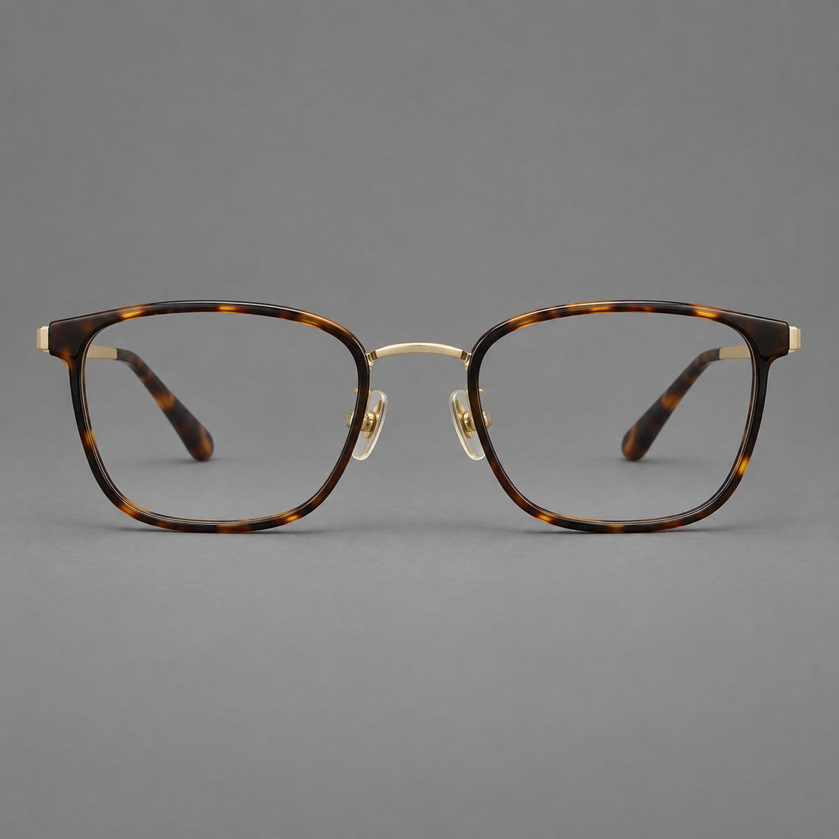 Rounded rectangular eyeglasses in acetate and titanium with bold corners and engraved metal temples — Tortoiseshell / Gold — Front view [CINILY-JD2026-61029-C1]