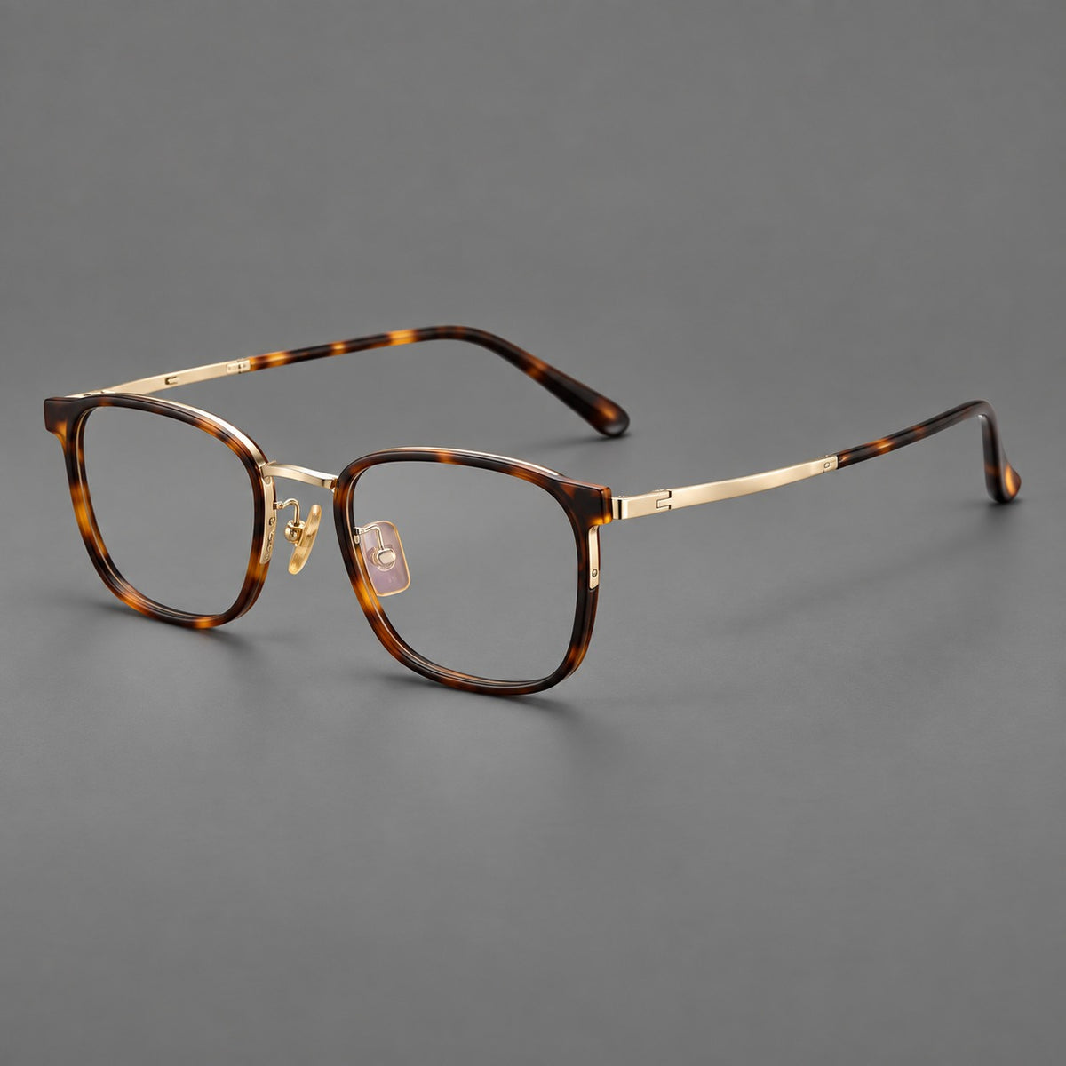 Rounded rectangular eyeglasses in acetate and titanium with bold corners and engraved metal temples — Tortoiseshell / Gold — Main view [CINILY-JD2026-61029-C1]