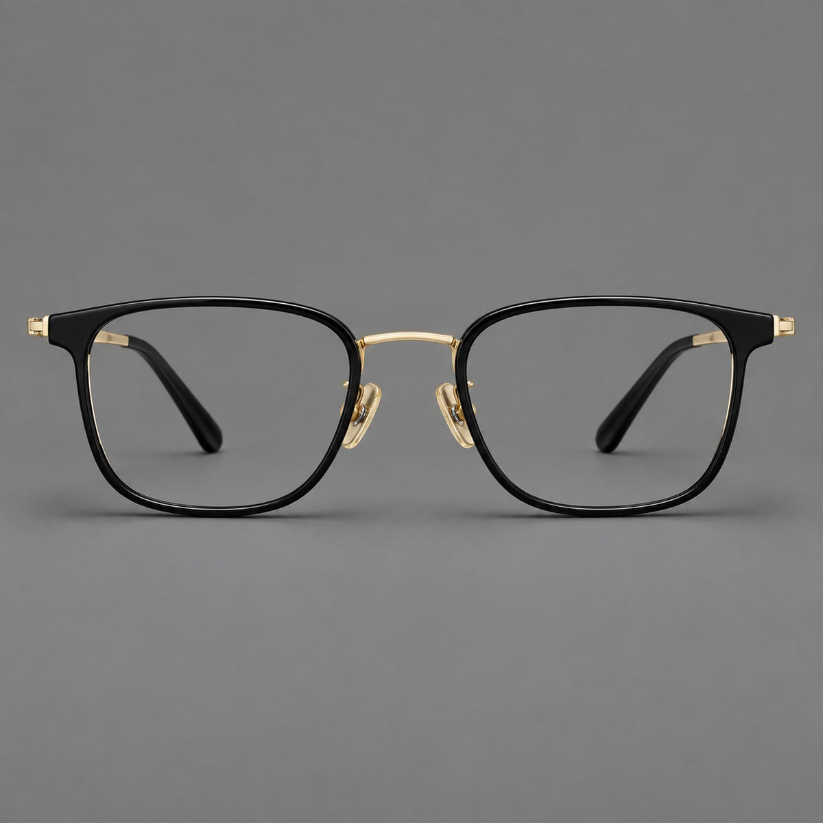 Rounded rectangular eyeglasses in acetate and titanium with bold corners and engraved metal temples — Glossy Black / Gold — Front view [CINILY-JD2026-61029-C3]