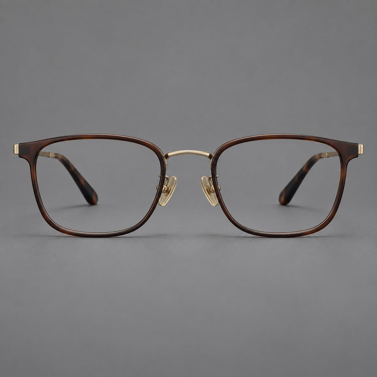Rounded rectangular eyeglasses in acetate and titanium with bold corners and engraved metal temples — Coffee Brown / Antique Bronze — Front view [CINILY-JD2026-61029-C5]