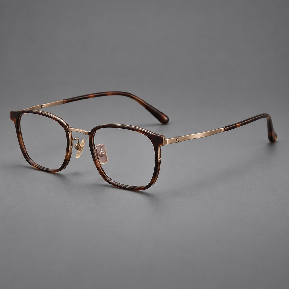 Rounded rectangular eyeglasses in acetate and titanium with bold corners and engraved metal temples — Coffee Brown / Antique Bronze — Main view [CINILY-JD2026-61029-C5]