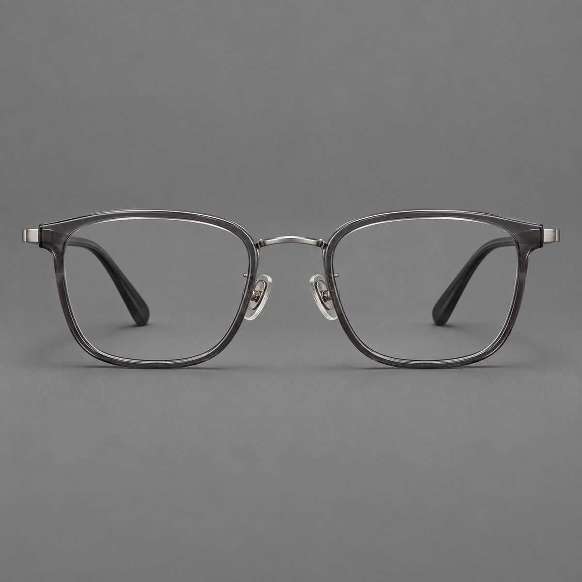 Rounded rectangular eyeglasses in acetate and titanium with bold corners and engraved metal temples — Clear Grey / Gunmetal — Front view [CINILY-JD2026-61029-C6]