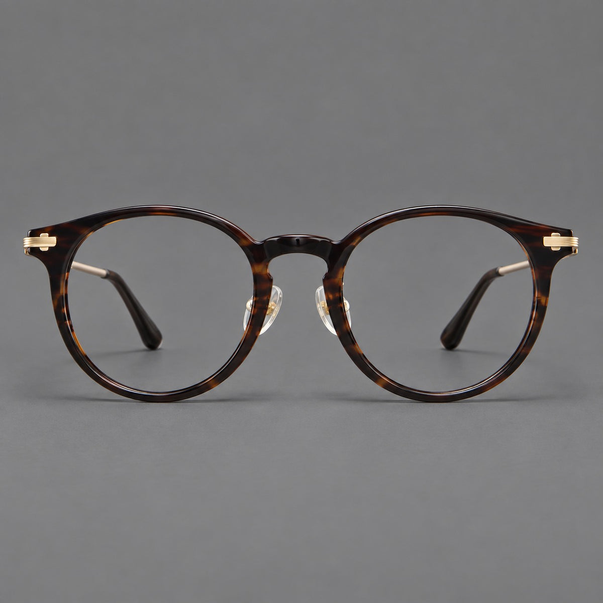 Retro acetate and titanium eyeglasses with round rims and a pronounced keyhole bridge — Brown Woodgrain / Gold — Front view [CINILY-JD2026-8006-C1]