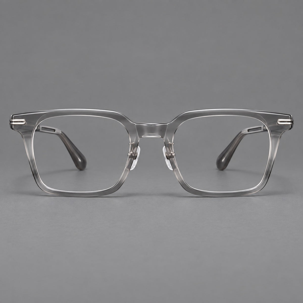 Modern acetate and titanium eyeglasses with angular square rims and curved metal hinges — Clear Grey — Front view [CINILY-JD2026-8010-C4]