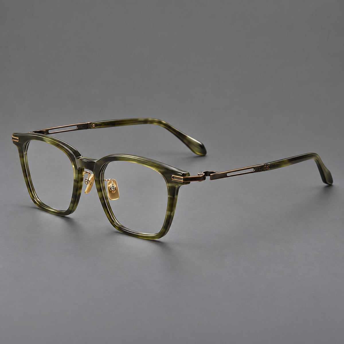 Acetate and titanium eyeglasses with rounded rectangular rims and sculpted open loop joints — Clear Olive Green / Antique Bronze — Main view [CINILY-JD2026-8012-C4]