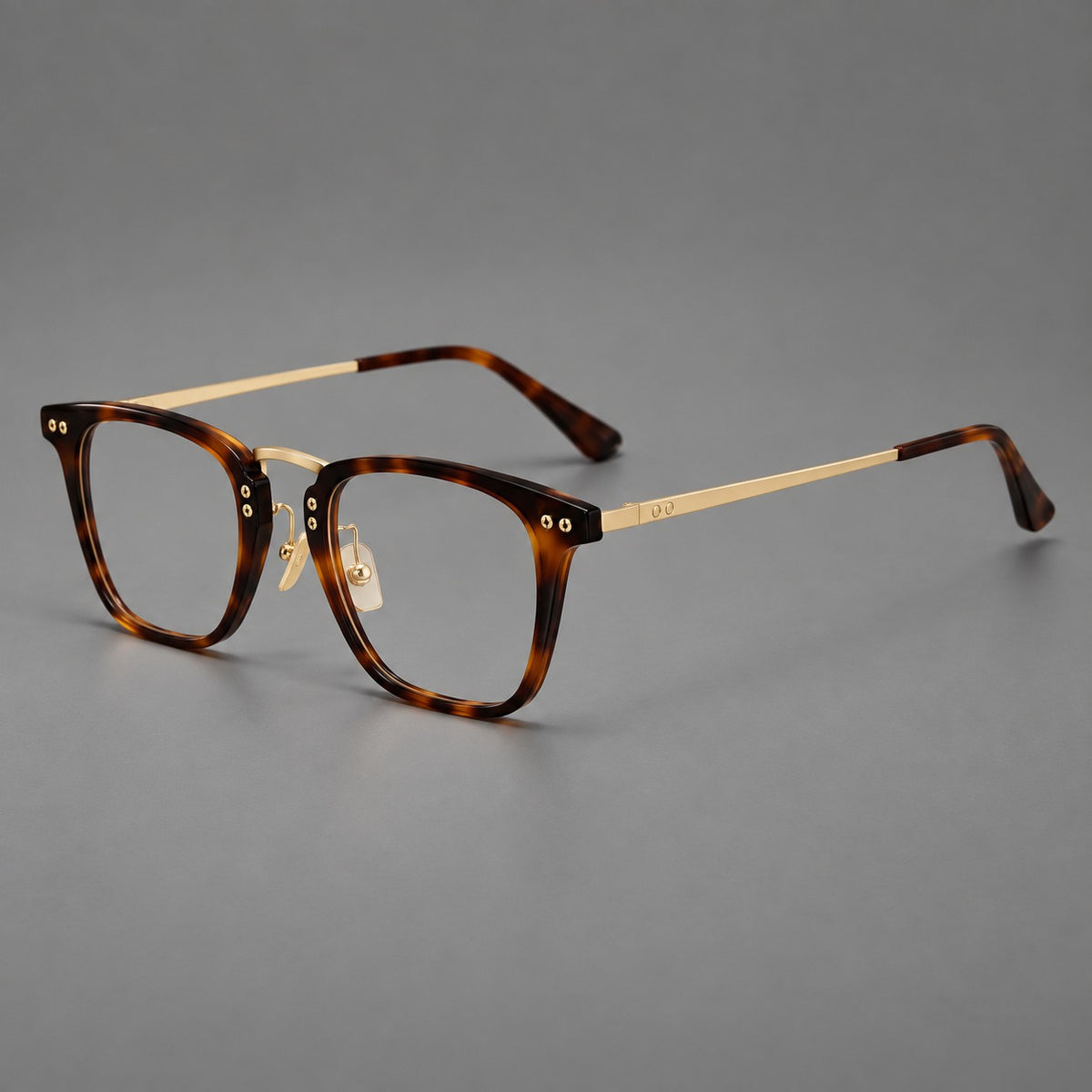 Acetate and titanium eyeglasses with soft square rims and an arched metal bridge — Tortoiseshell / Gold — Main view [CINILY-JD2026-8018-C1]