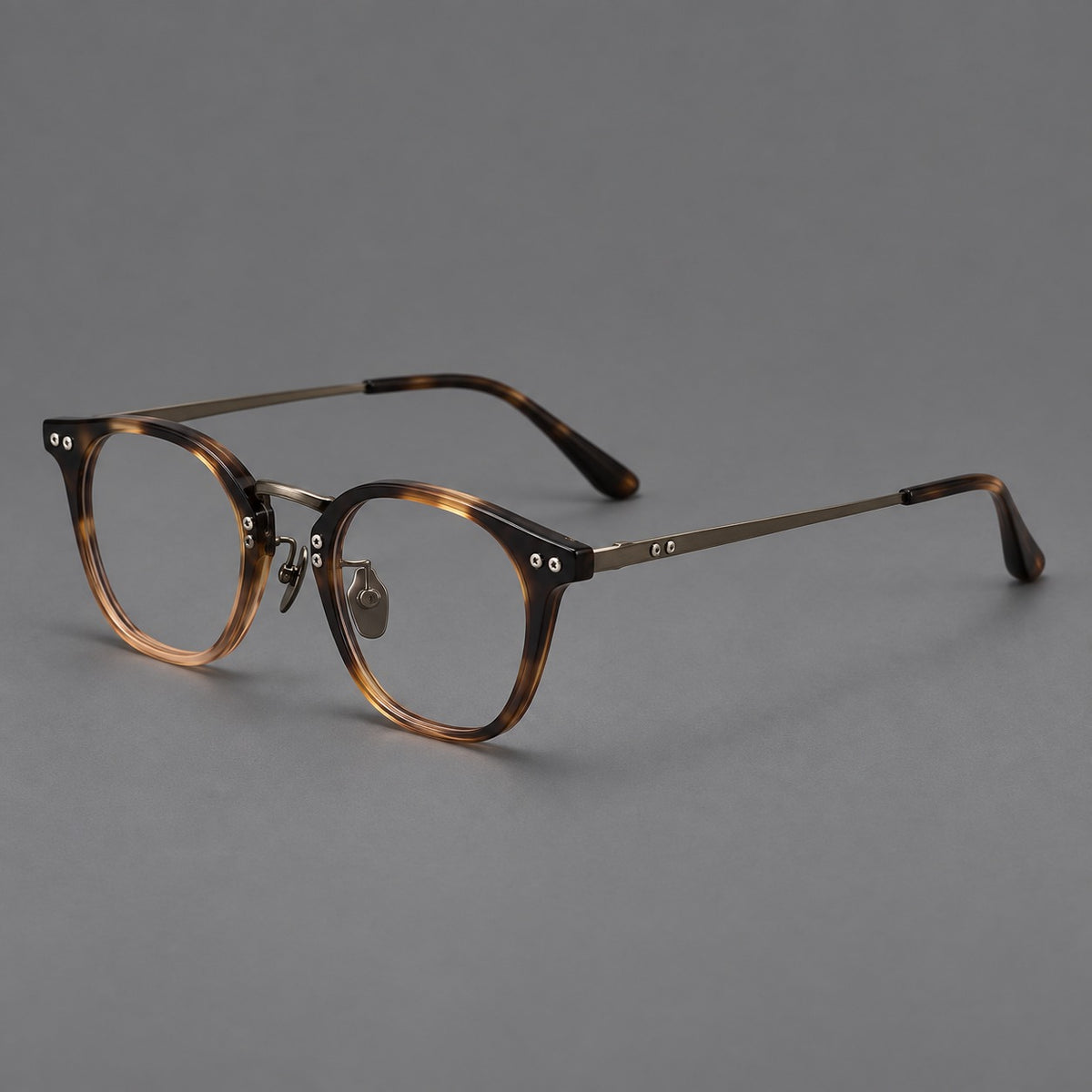 Retro acetate and titanium eyeglasses with softly rounded rims and a metal bridge — Tortoiseshell / Gunmetal — Main view [CINILY-JD2026-8020-C1]