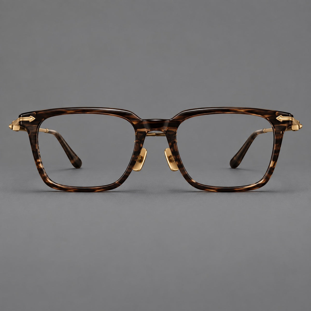 Bold acetate and titanium eyeglasses with rectangular rims and sculpted arrow accents — Tea Woodgrain / Antique Bronze — Front view [CINILY-JD2026-8023-C2]