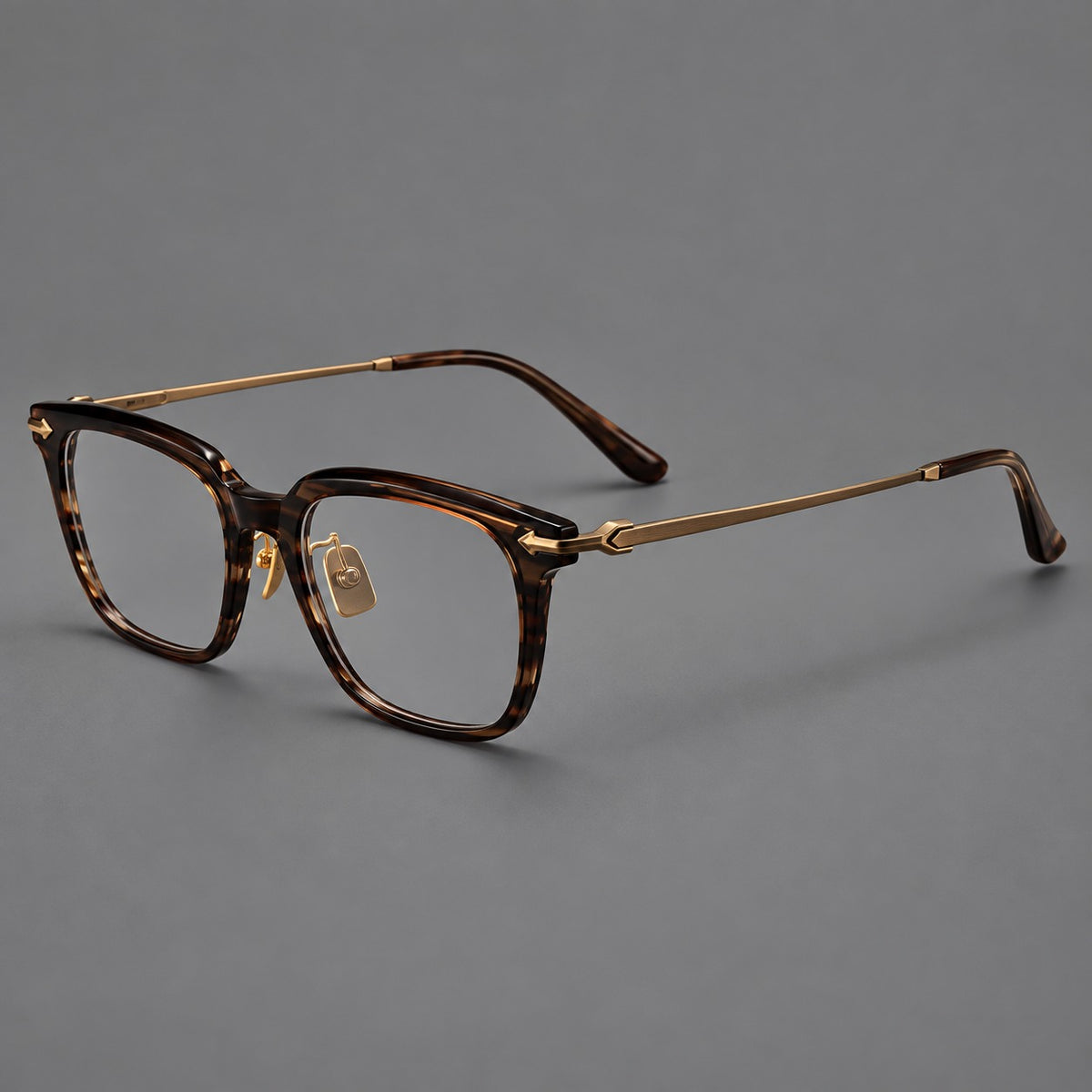Bold acetate and titanium eyeglasses with rectangular rims and sculpted arrow accents — Tea Woodgrain / Antique Bronze — Main view [CINILY-JD2026-8023-C2]