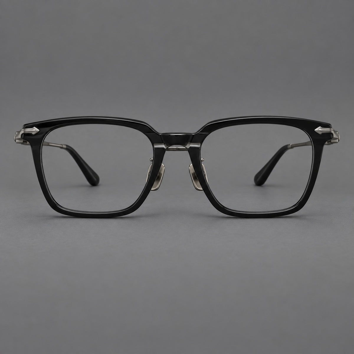 Bold acetate and titanium eyeglasses with rectangular rims and sculpted arrow accents — Black / Gunmetal — Front view [CINILY-JD2026-8023-C3]