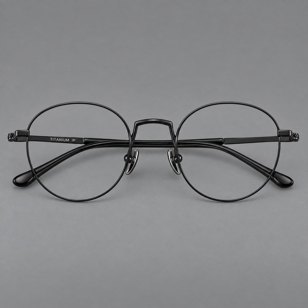 Retro round titanium glasses with a raised bridge and smooth corner shoulders — Black — Front view [CINILY-JD2026-88006-C1]