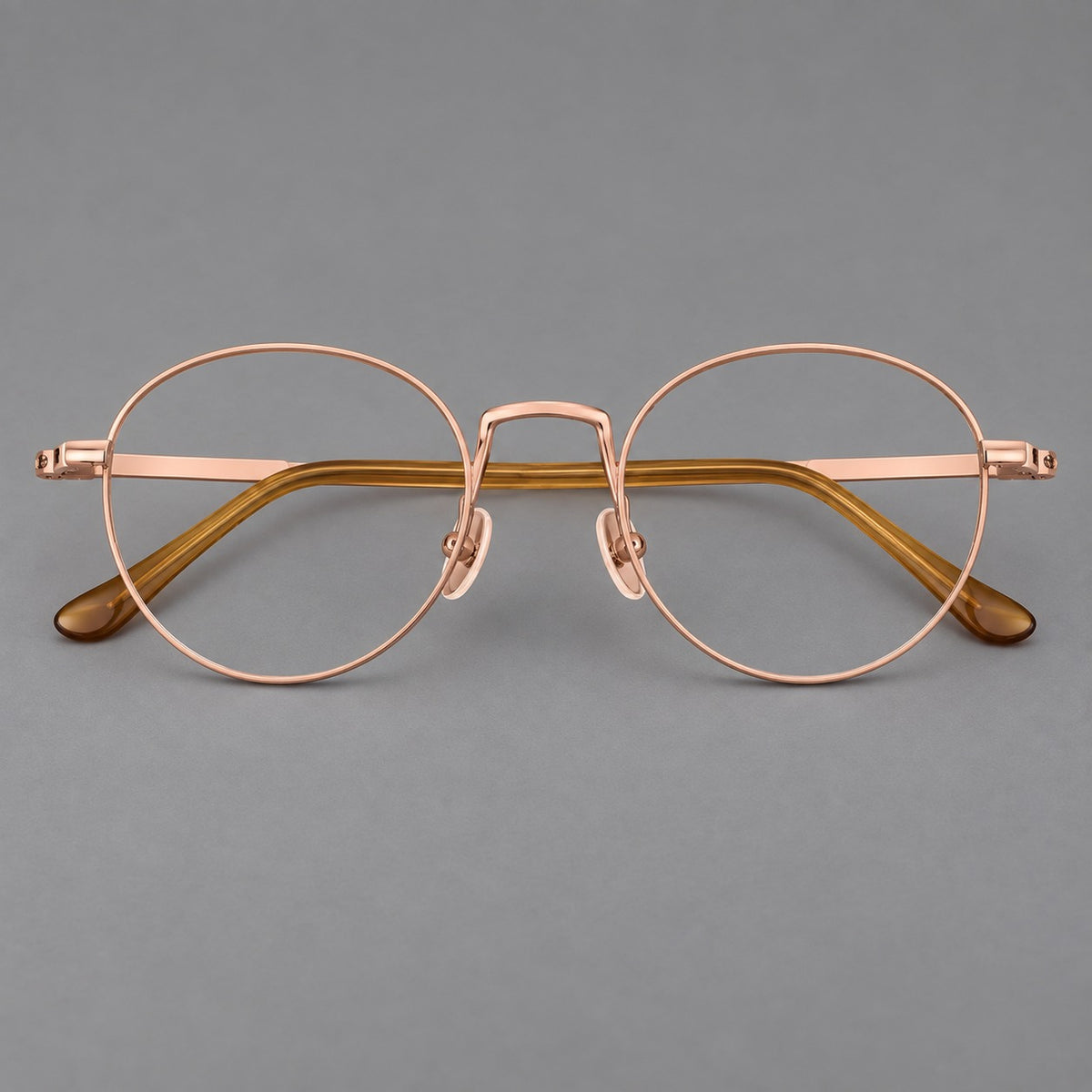 Retro round titanium glasses with a raised bridge and smooth corner shoulders — Rose Gold — Front view [CINILY-JD2026-88006-C5]
