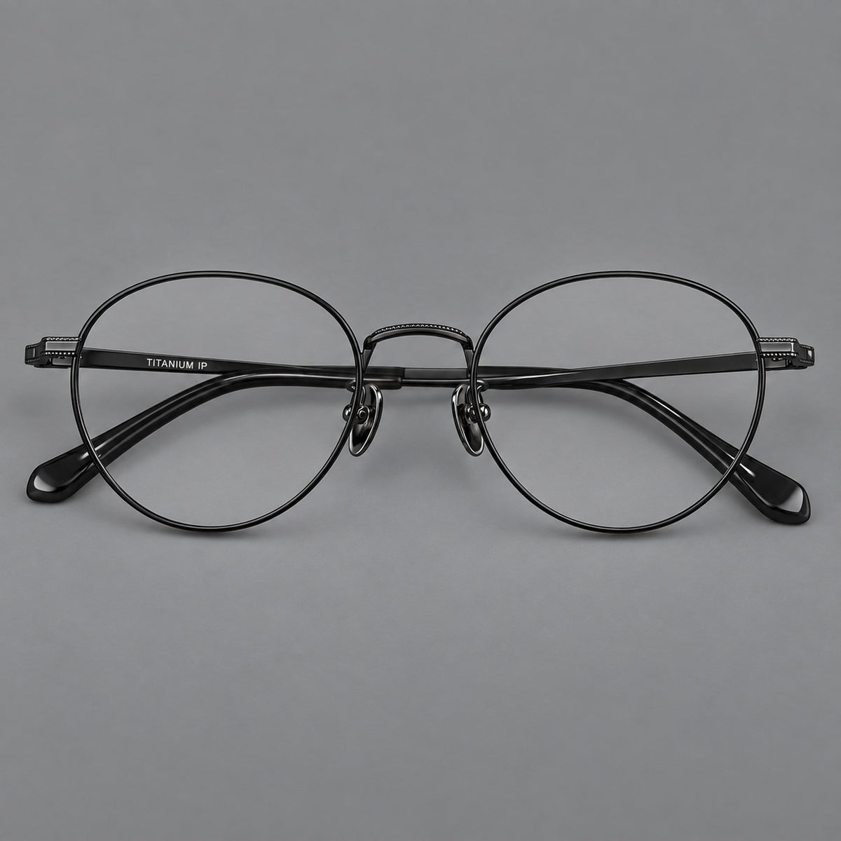 Rounded panto titanium glasses with a raised bridge and dotted temple accents — Black — Front view [CINILY-JD2026-88017-C1]