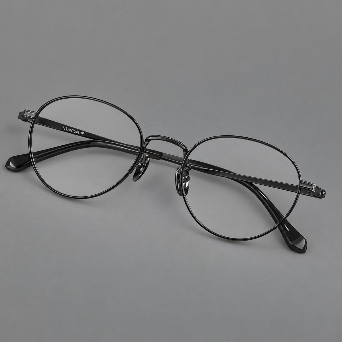 Rounded panto titanium glasses with a raised bridge and dotted temple accents — Black — Main view [CINILY-JD2026-88017-C1]