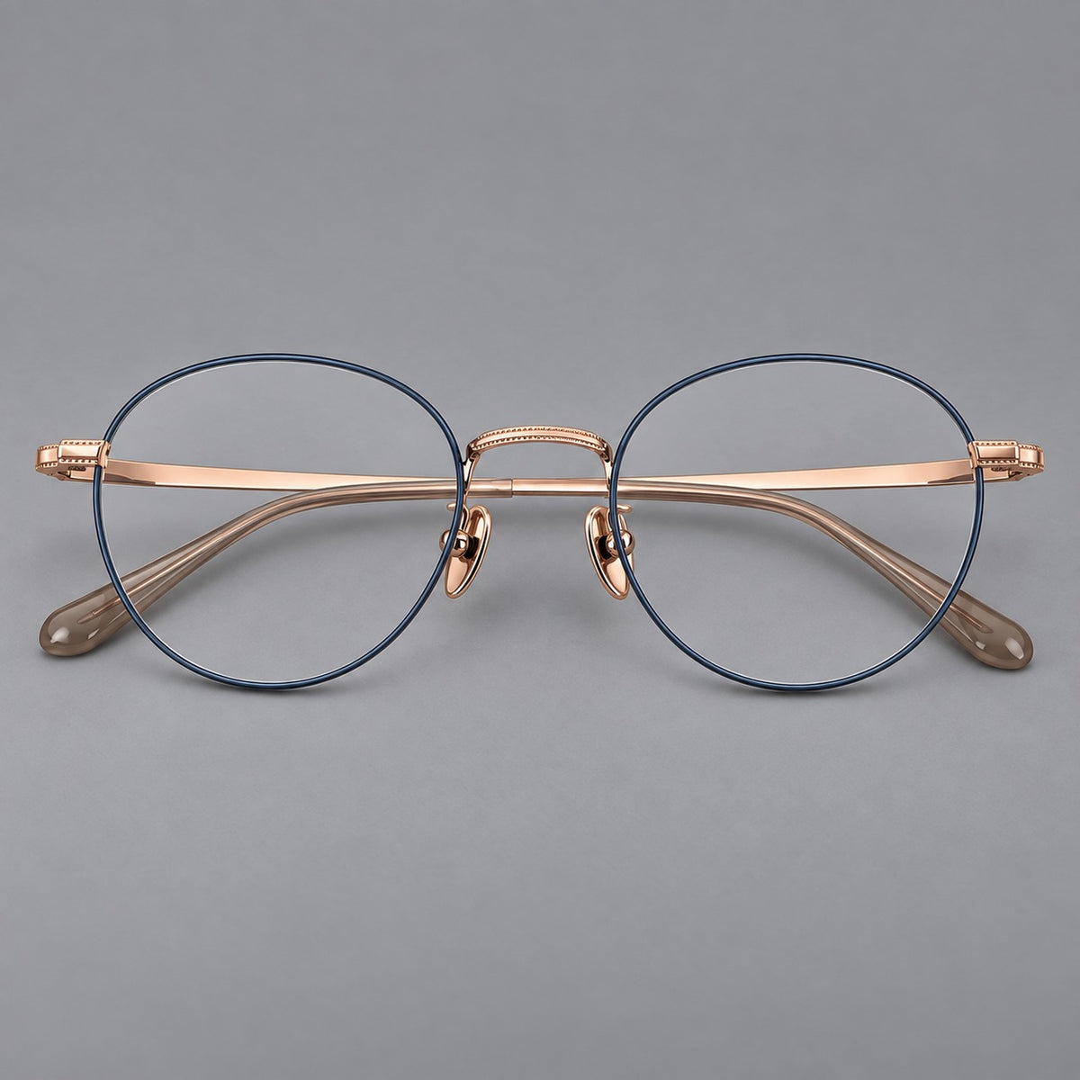 Rounded panto titanium glasses with a raised bridge and dotted temple accents — Blue and Rose Gold — Front view [CINILY-JD2026-88017-C2]