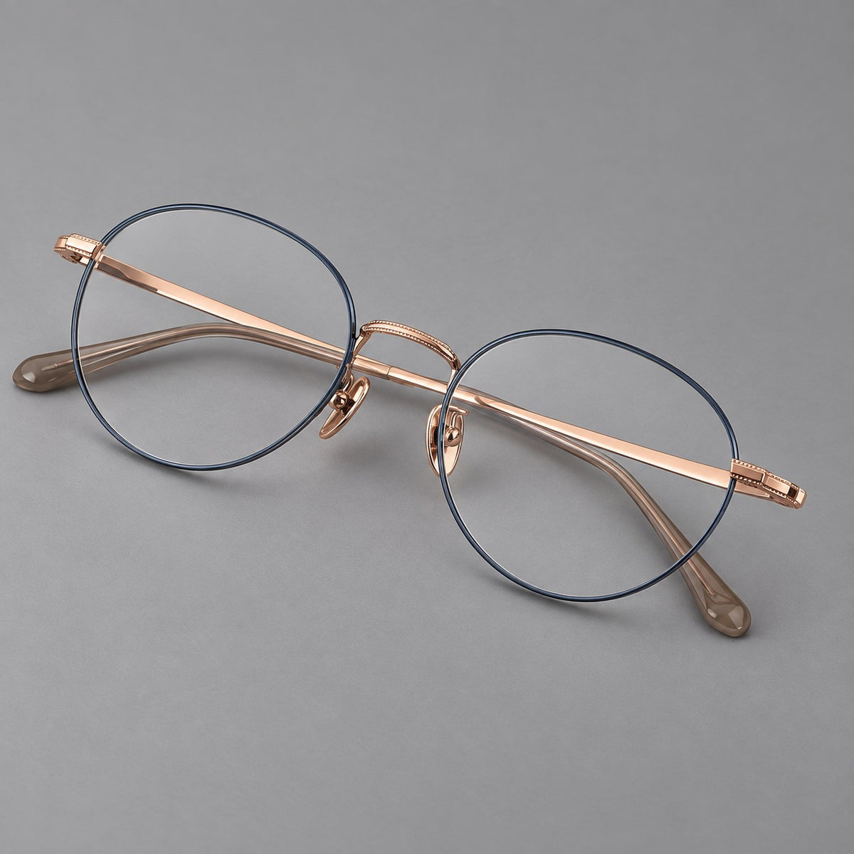 Rounded panto titanium glasses with a raised bridge and dotted temple accents — Blue and Rose Gold — Main view [CINILY-JD2026-88017-C2]