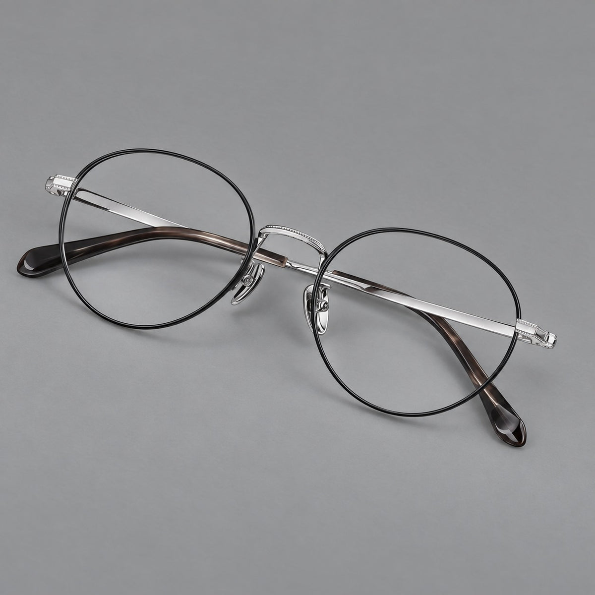 Rounded panto titanium glasses with a raised bridge and dotted temple accents — Black and Silver — Main view [CINILY-JD2026-88017-C3]