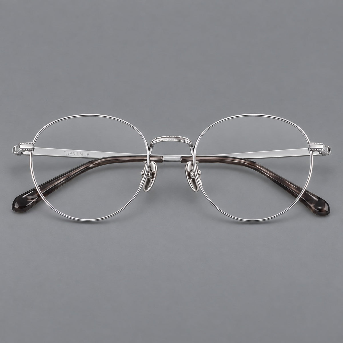 Rounded panto titanium glasses with a raised bridge and dotted temple accents — Silver — Front view [CINILY-JD2026-88017-C4]