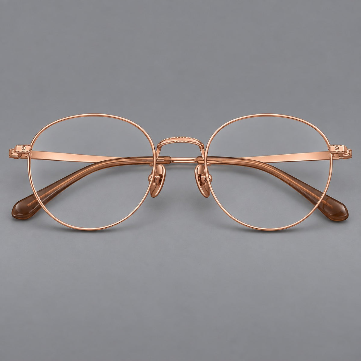 Rounded panto titanium glasses with a raised bridge and dotted temple accents — Rose Gold — Front view [CINILY-JD2026-88017-C5]