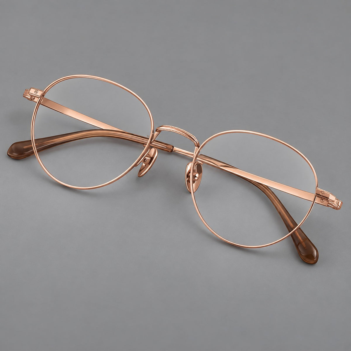 Rounded panto titanium glasses with a raised bridge and dotted temple accents — Rose Gold — Main view [CINILY-JD2026-88017-C5]