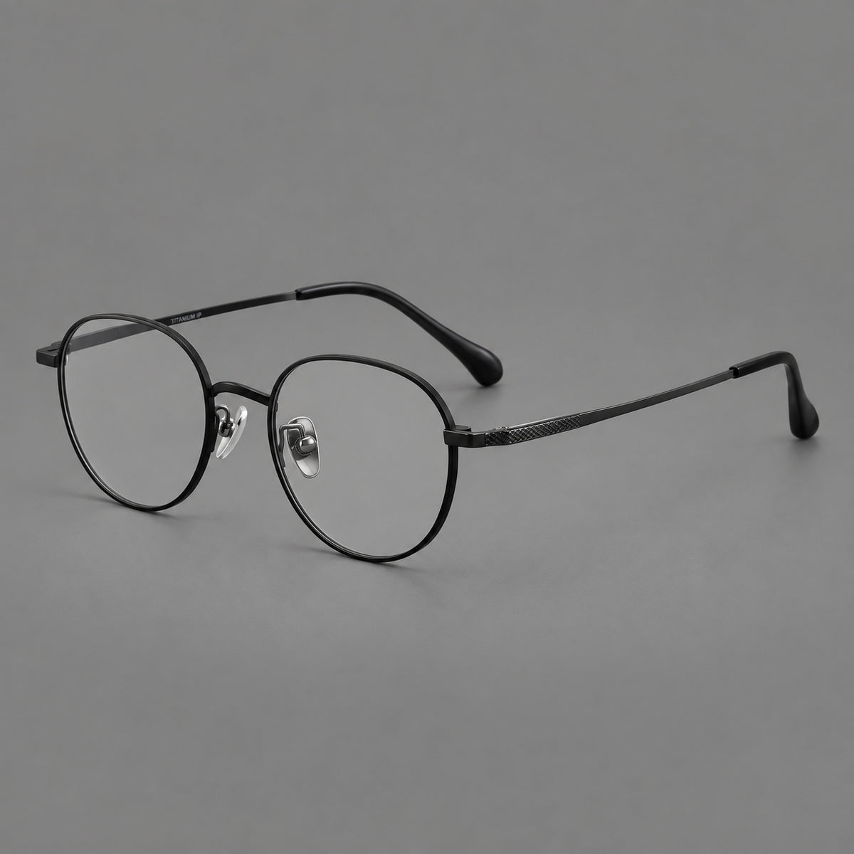 Compact round titanium glasses with an arched bridge and textured temple accents — Black — Main view [CINILY-JD2026-88027-C1]