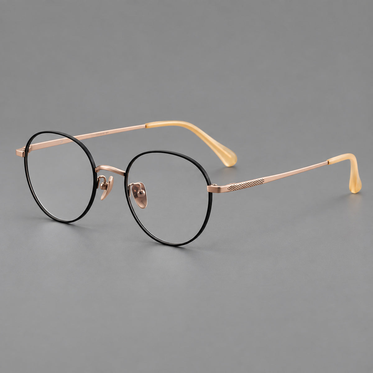 Compact round titanium glasses with an arched bridge and textured temple accents — Black and Rose Gold — Main view [CINILY-JD2026-88027-C3]