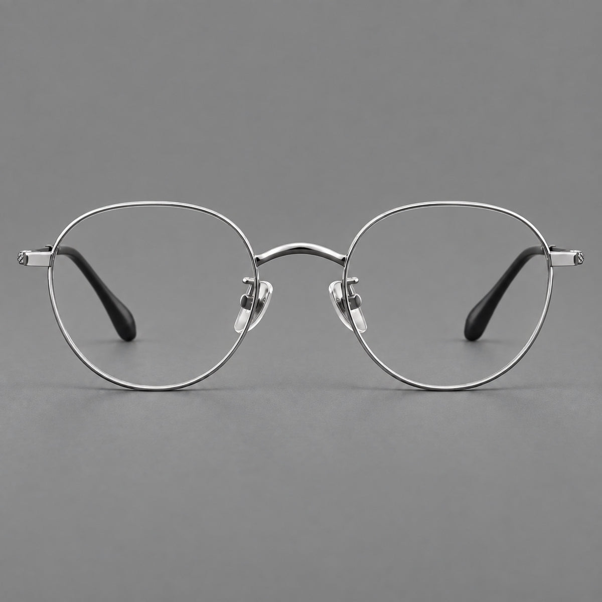 Compact round titanium glasses with an arched bridge and textured temple accents — Silver — Front view [CINILY-JD2026-88027-C4]