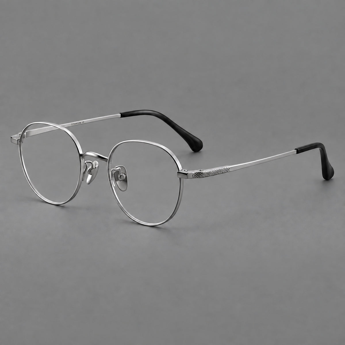 Compact round titanium glasses with an arched bridge and textured temple accents — Silver — Main view [CINILY-JD2026-88027-C4]