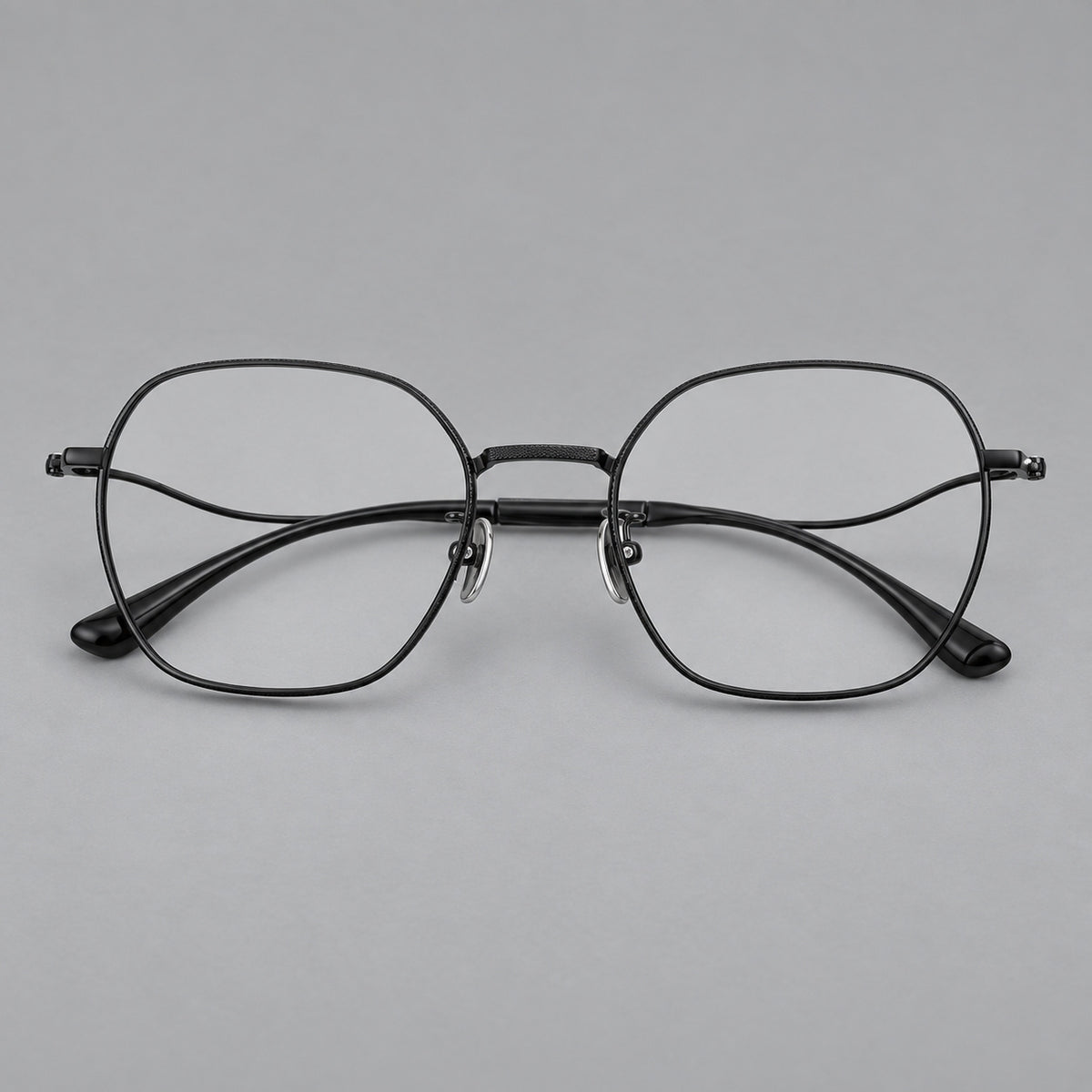 Geometric titanium glasses with engraved rim edges and curved temple joins — Black — Front view [CINILY-JD2026-88042-C1]