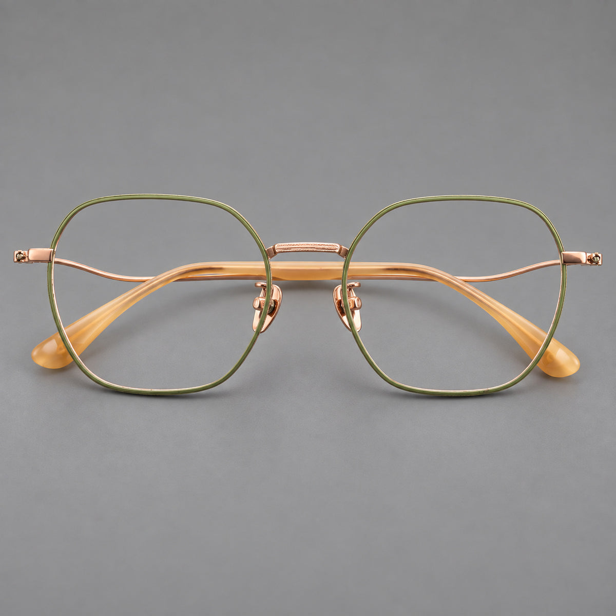 Geometric titanium glasses with engraved rim edges and curved temple joins — Green and Rose Gold — Front view [CINILY-JD2026-88042-C3]