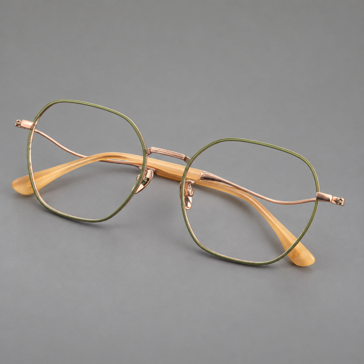 Geometric titanium glasses with engraved rim edges and curved temple joins — Green and Rose Gold — Main view [CINILY-JD2026-88042-C3]