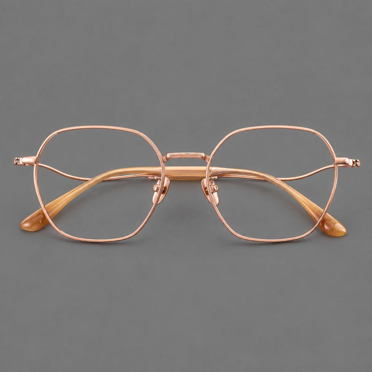 Geometric titanium glasses with engraved rim edges and curved temple joins — Rose Gold — Front view [CINILY-JD2026-88042-C5]