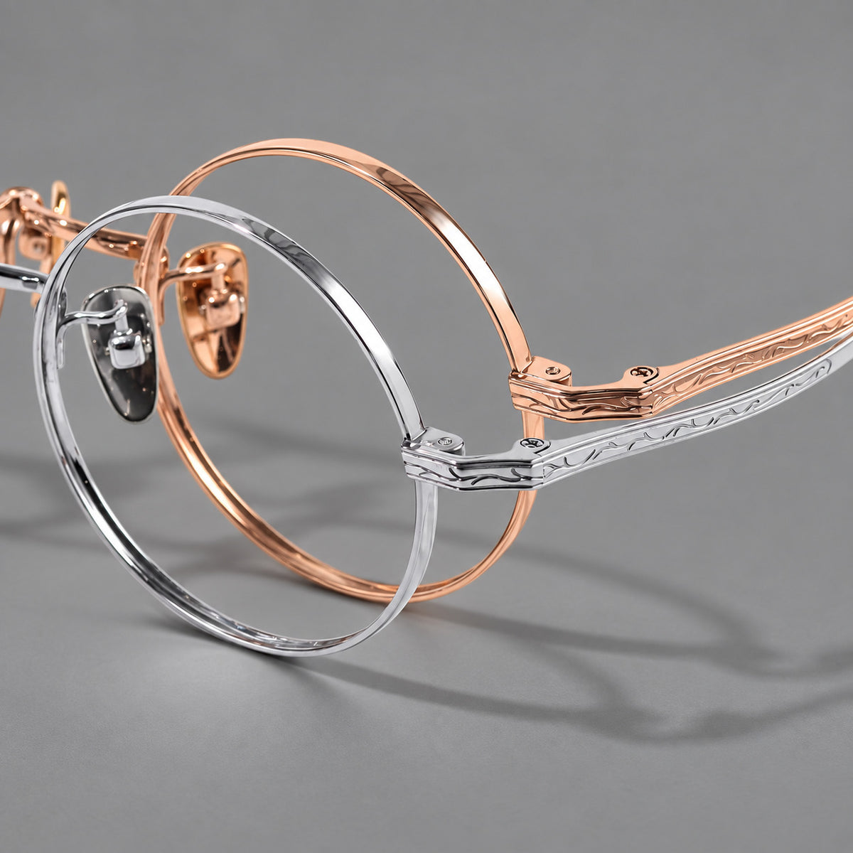 Compact circular titanium glasses with a curved bridge and wavy engraved temples — 88047 — Frame details [JD2026-88047]