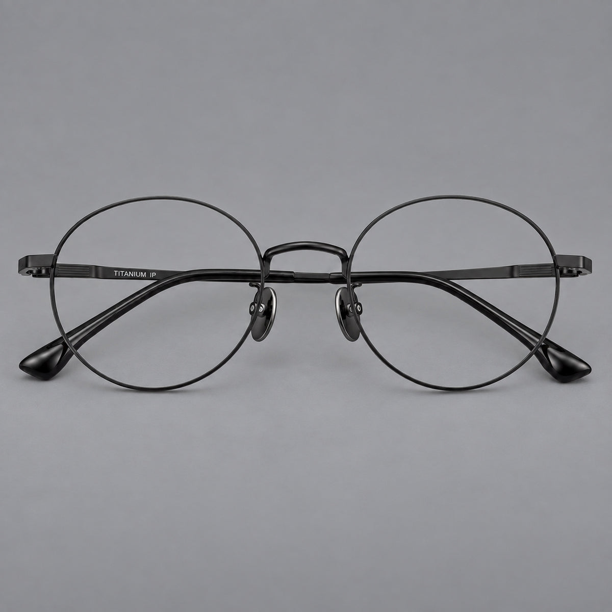 Classic circular titanium glasses with a raised bridge and lined temple accents — Black — Front view [CINILY-JD2026-88049-C1]