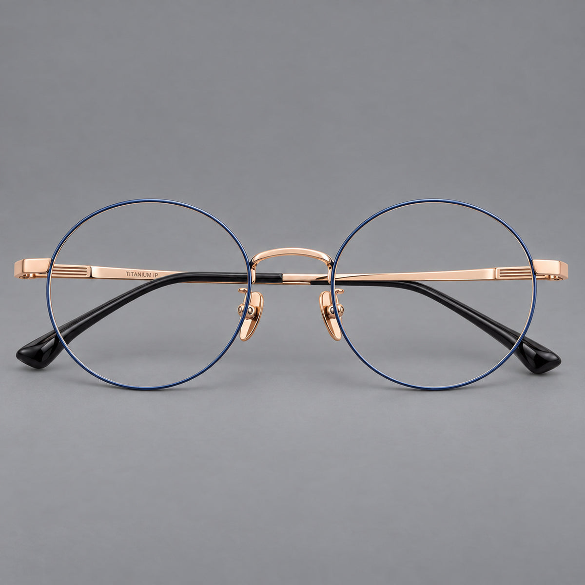 Classic circular titanium glasses with a raised bridge and lined temple accents — Blue and Gold — Front view [CINILY-JD2026-88049-C2]
