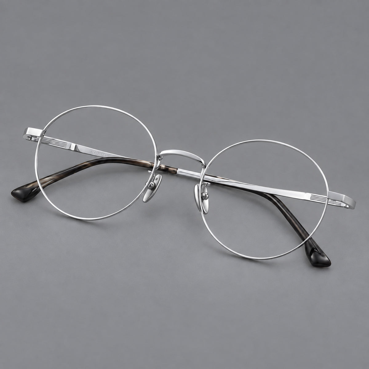 Classic circular titanium glasses with a raised bridge and lined temple accents — Silver — Main view [CINILY-JD2026-88049-C4]
