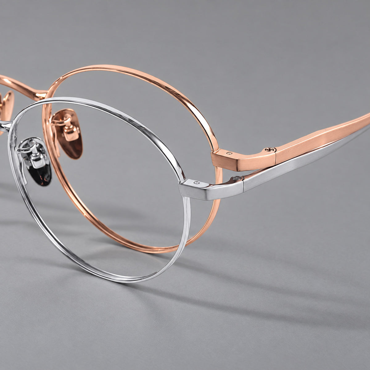 Classic circular titanium glasses with a raised bridge and lined temple accents — 88049 — Frame details [JD2026-88049]