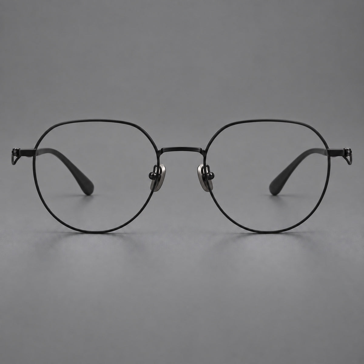 Rounded titanium glasses with a short bridge and distinctive wavy metal temples — Matte Black — Front view [CINILY-JD2026-88050-C1]