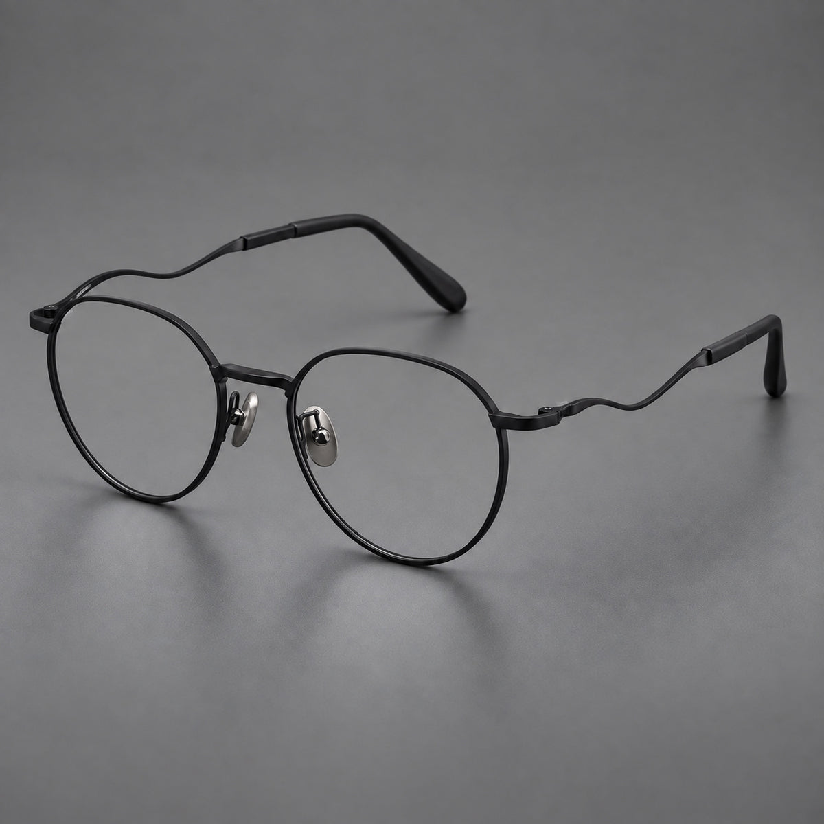 Rounded titanium glasses with a short bridge and distinctive wavy metal temples — Matte Black — Main view [CINILY-JD2026-88050-C1]