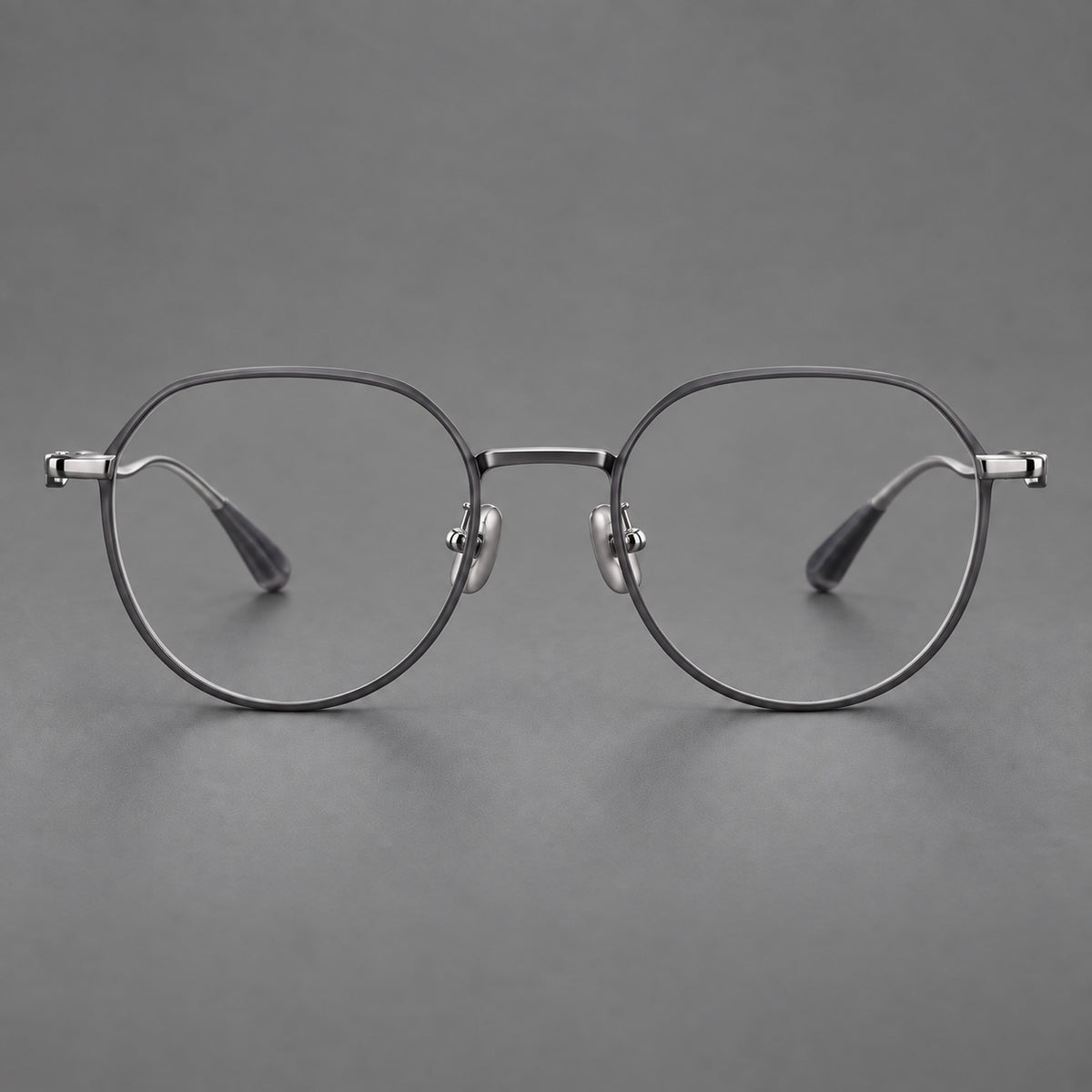 Rounded titanium glasses with a short bridge and distinctive wavy metal temples — Matte Grey and Silver — Front view [CINILY-JD2026-88050-C2]