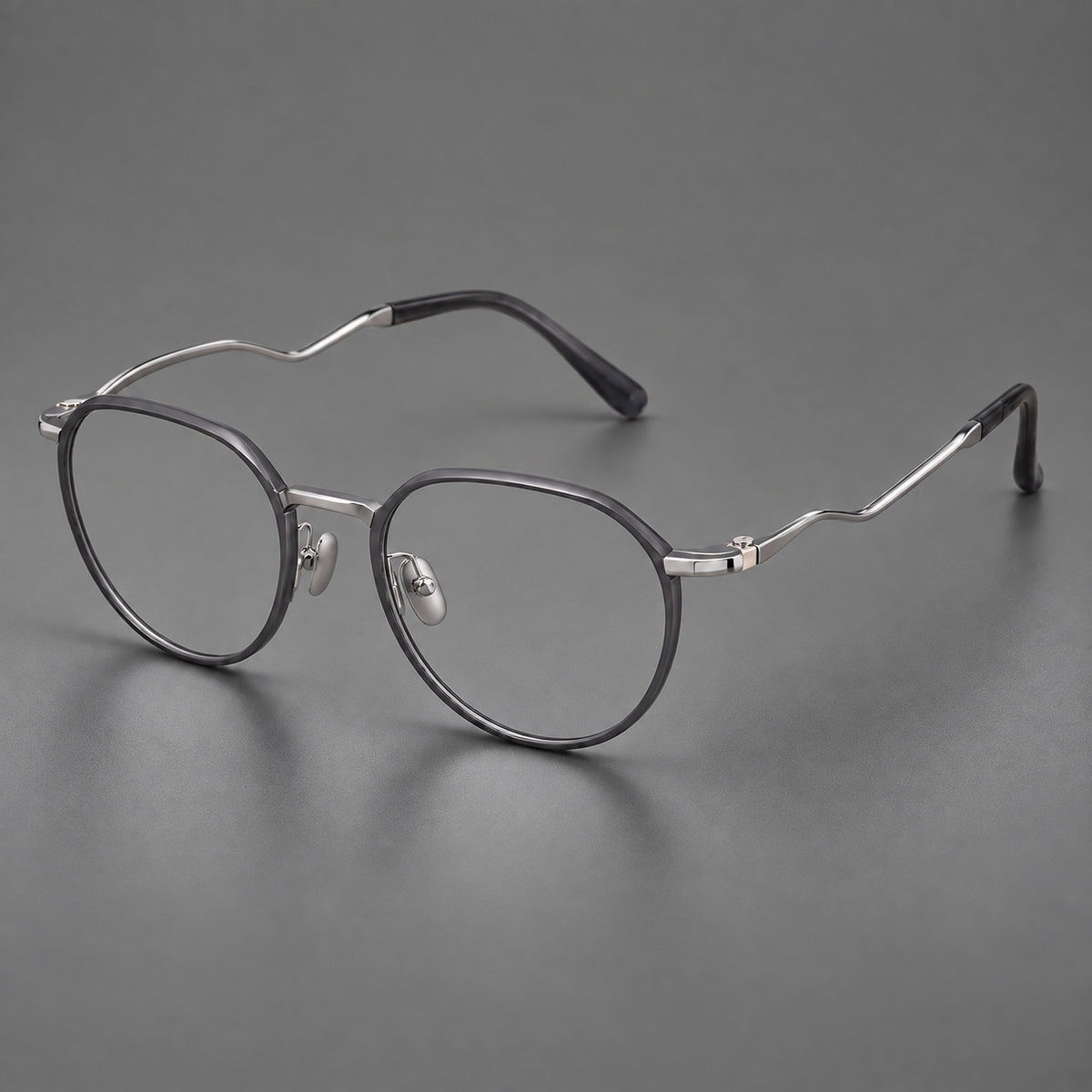 Rounded titanium glasses with a short bridge and distinctive wavy metal temples — Matte Grey and Silver — Main view [CINILY-JD2026-88050-C2]