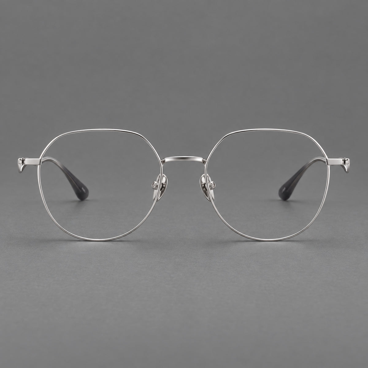 Rounded titanium glasses with a short bridge and distinctive wavy metal temples — Silver — Front view [CINILY-JD2026-88050-C4]