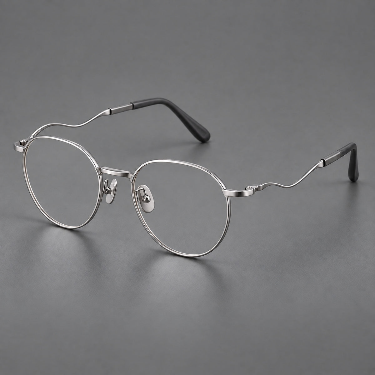 Rounded titanium glasses with a short bridge and distinctive wavy metal temples — Silver — Main view [CINILY-JD2026-88050-C4]