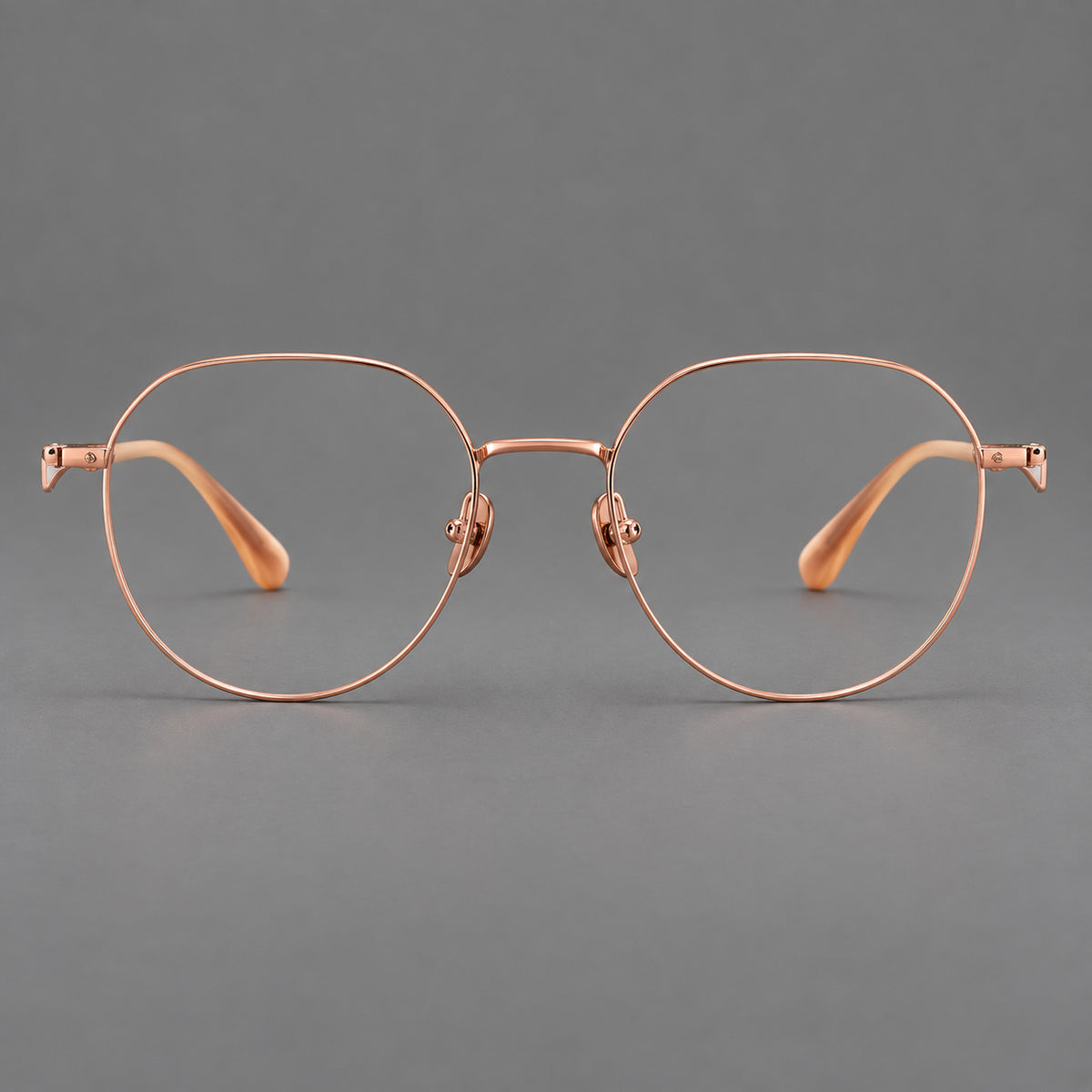 Rounded titanium glasses with a short bridge and distinctive wavy metal temples — Rose Gold — Front view [CINILY-JD2026-88050-C5]
